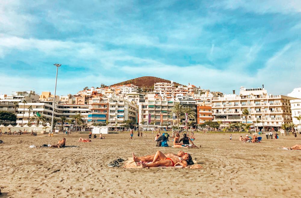 people relaxing on Los Cristianos beach 