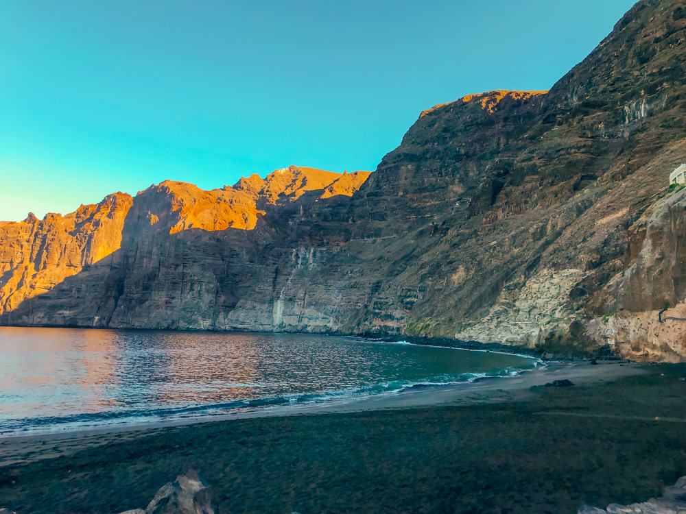 Los Gigantes Beach with black sand and cliffs 